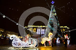 Santa Claus and Snow Maiden in glowing sleigh