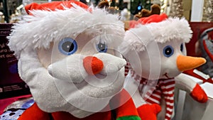 Santa Claus and snowman close up