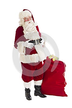 Santa Claus Standing With Bag Full Of Gifts