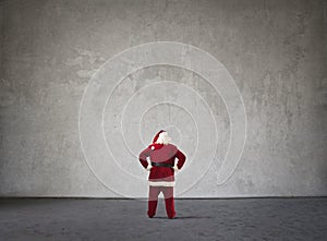 Santa Claus standing in front of a wall