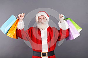 Santa Claus Standing With A Lot Of Purchases