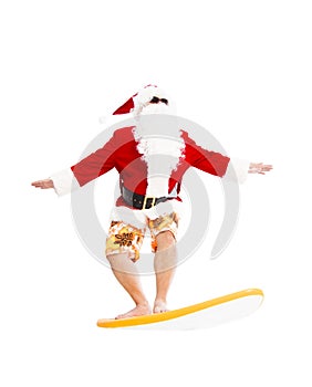 Santa Claus surfing with surf board
