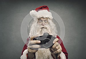 Santa Claus taking holiday pictures