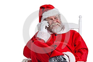 Santa claus talking on mobile phone