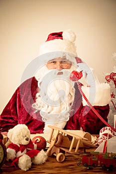 Santa Claus talking by phone