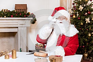 Santa claus talking on smartphone