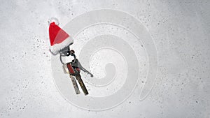 Santa Claus theme: Santa`s hand holding the keys to a new appartament