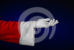 Santa Claus theme: Santa's hand showing gesture on a dark blue background