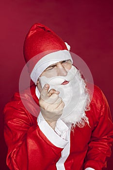 Santa Claus threatens you with a finger