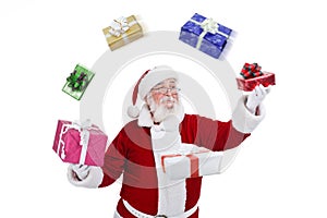 Santa Claus throwing and playing with presents