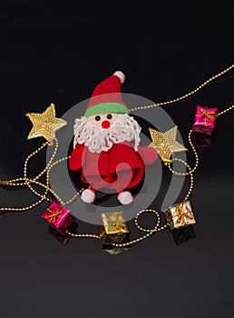Santa Claus toy and Christmas garland