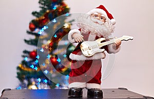 Santa Claus toy playing guitar