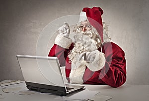 Santa Claus typing on the keyboard