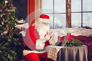 Santa Claus using a smart phone