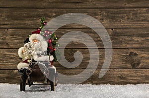 Santa Claus: Vintage christmas decoration on wooden brown background in vintage look.