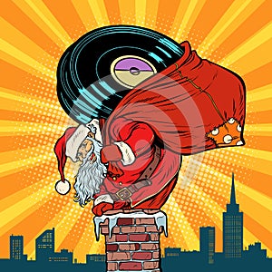 Santa Claus with vinyl records climbs into the chimney