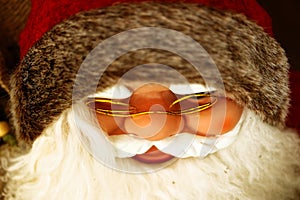 Santa Claus with white beard and red hat