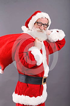 Santa Claus With A White Beard Standing With The Bag
