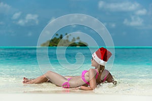 Santa claus woman on beach