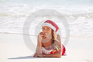 Santa Claus woman on beach