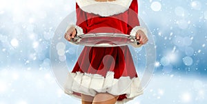 Santa Claus woman with white blue background and empty space for your decoration. Christmas time.