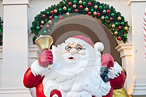 Santa clause with golden bell on hand