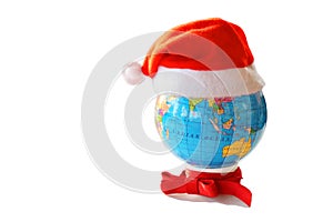 Santa Clause hat on a globe
