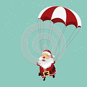 Santa clause is parachuting in the air. Christmas ornament. photo