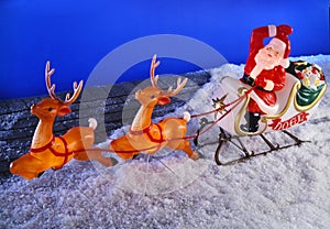 Santa clause and reindeer on roof