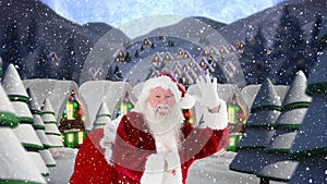 Santa clause waving in front of decorated houses combined with falling snow