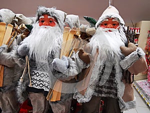 Santa Clauses with wooden skis