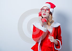 Santa Clous girl with eyeglasses and handset
