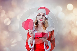 Santa Clous girl with heart shape gift