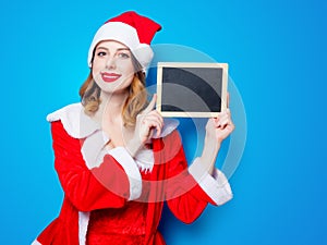 Santa Clous girl in red clothes with board