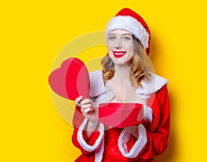 Santa Clous girl in red clothes with gift box