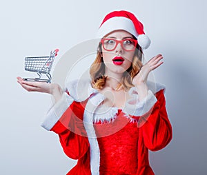 Santa Clous girl with shopping cart