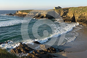 Santa Comba hermitage in the Santa Comba beach in the coast of Galicia at sunset in a sunny day. A CoruÃ±a, Spain