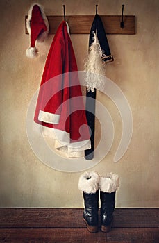 Santa costume with boots on coatrack