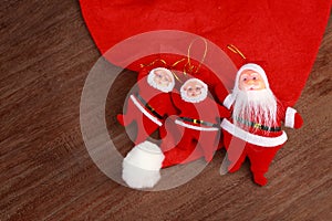 Santa dolls on a wodden background