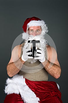 Santa drinking a pot of coffee