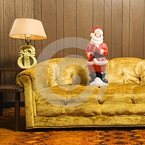 Santa figurine on couch.