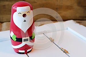 Santa figurine on white wood
