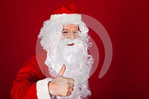 Santa gesturing thumb-up