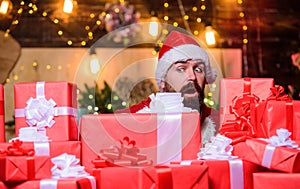 Santa with gifts. Bearded Santa Claus and many holiday packages. Best prices for winter gifts. Seasonal offer. Christmas