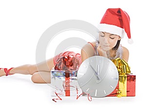 Santa girl with clock waiting midnight