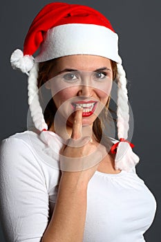 santa girl with finger in mouth