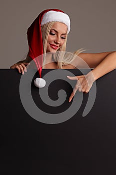 Santa girl holding blank billboard