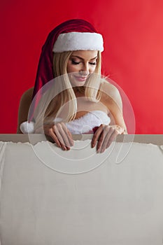 Santa girl holding blank billboard