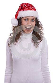 Santa girl in red Christmas cap surprised