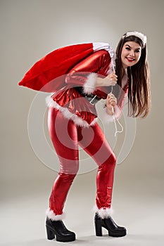 Santa girl with a sack of presents